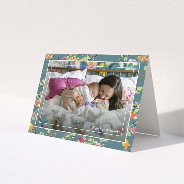 Floral baby thank you card with one photo of a mother and sleeping baby.