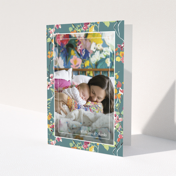 Floral baby thank you card with one photo of a mother and sleeping baby.