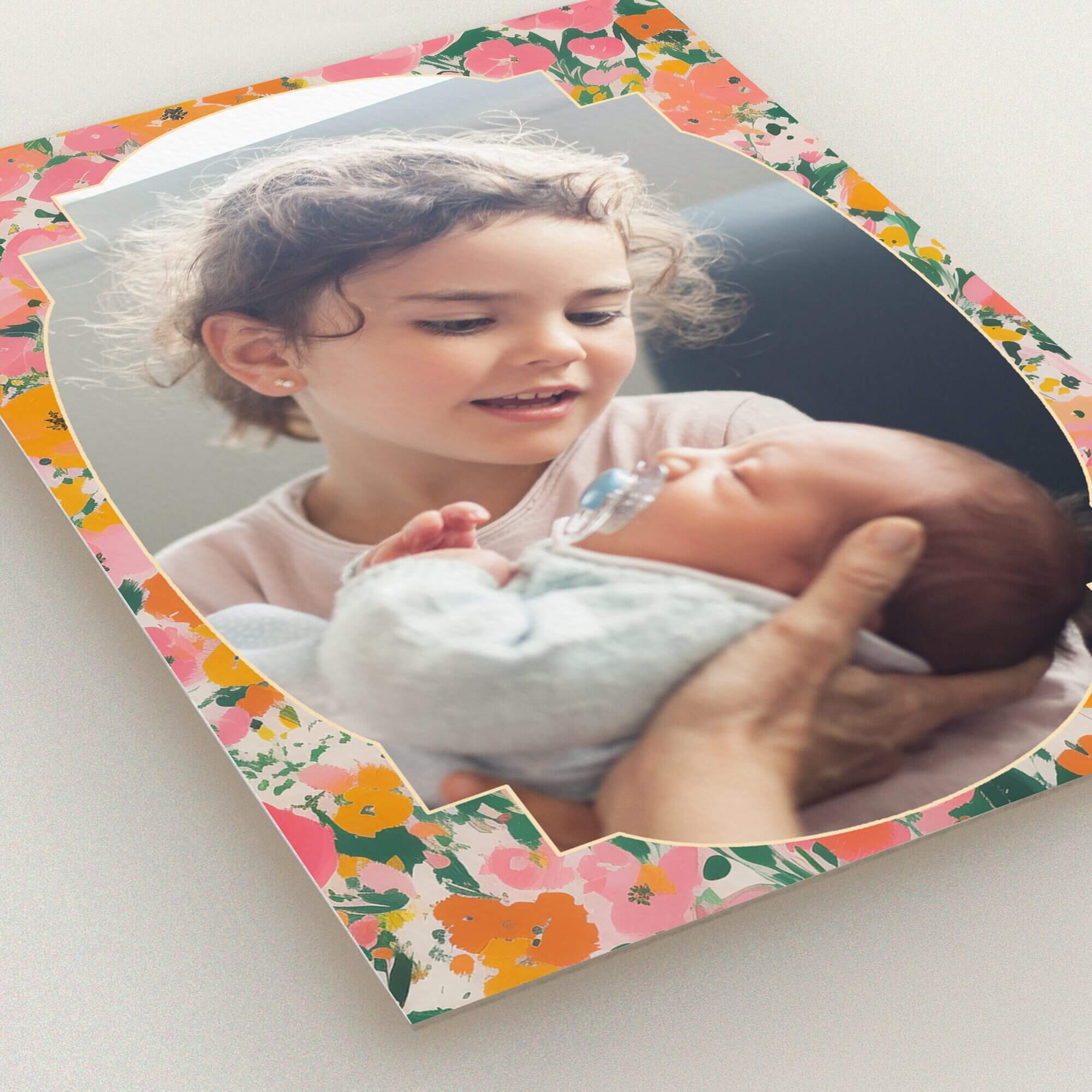 Floral birth announcement card design with one photo of siblings.