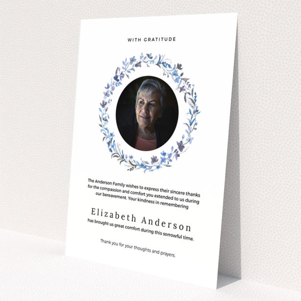 Funeral thank you card with floral wreath and photo of deceased