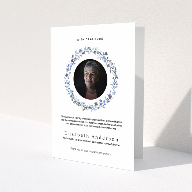 Funeral thank you card with floral wreath and photo of deceased