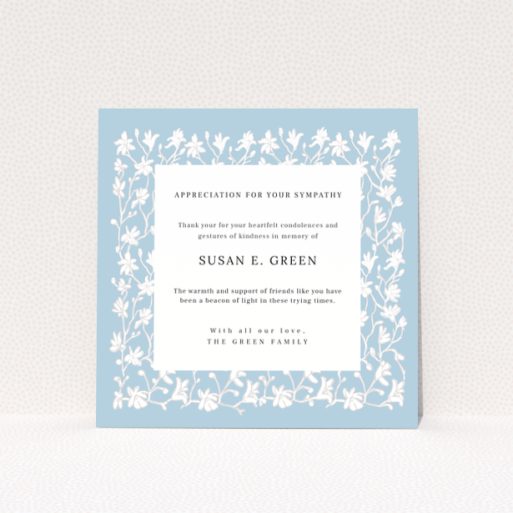 Floral funeral thank you card design with blue background and white flowers