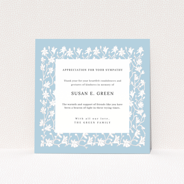 Floral funeral thank you card design with blue background and white flowers