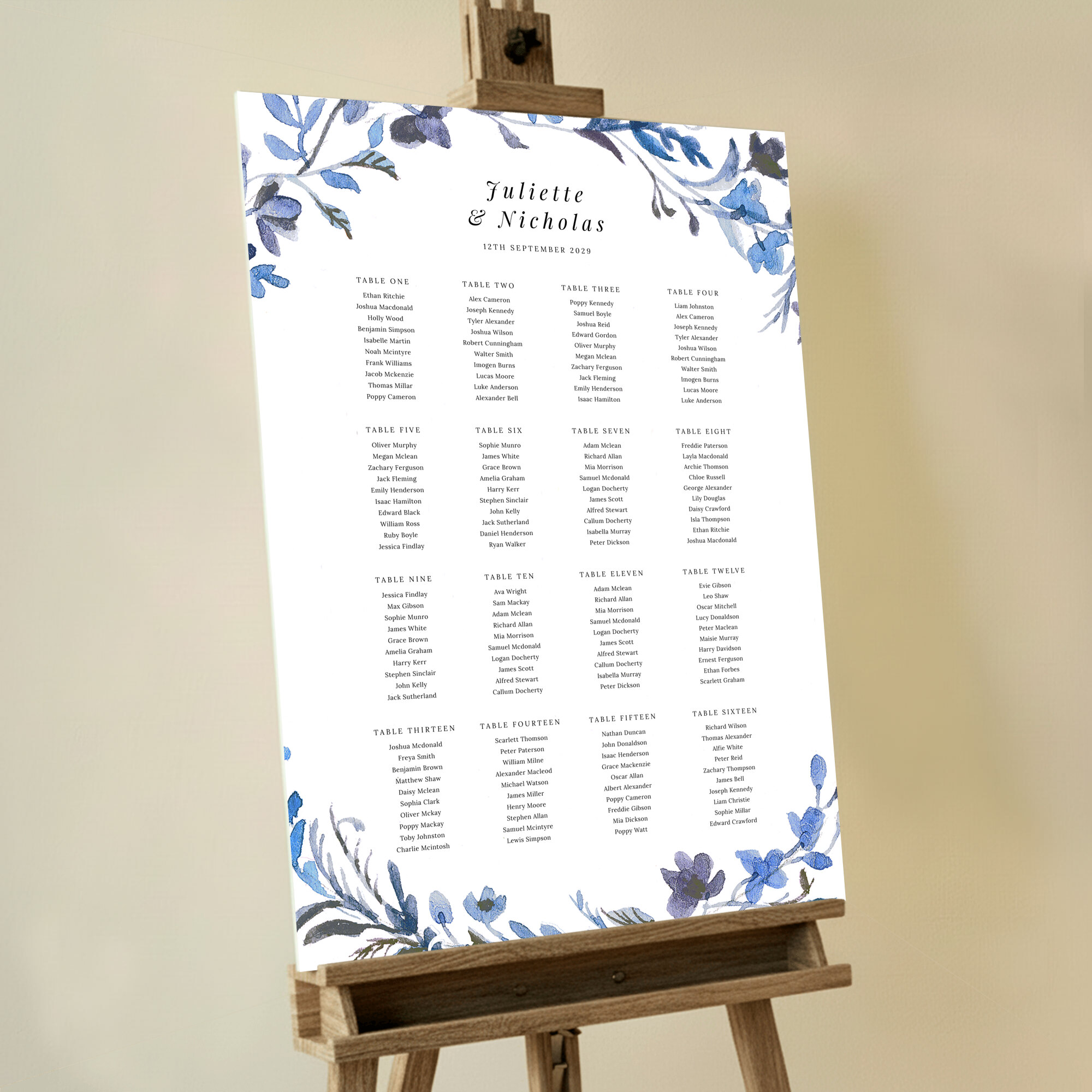 Custom Blue Floral Wreath Seating Plan featuring a beautiful arrangement of blue and purple flowers running along the top and bottom, creating an elegant and enchanting design, perfect for your special day.. This template shows 16 tables.