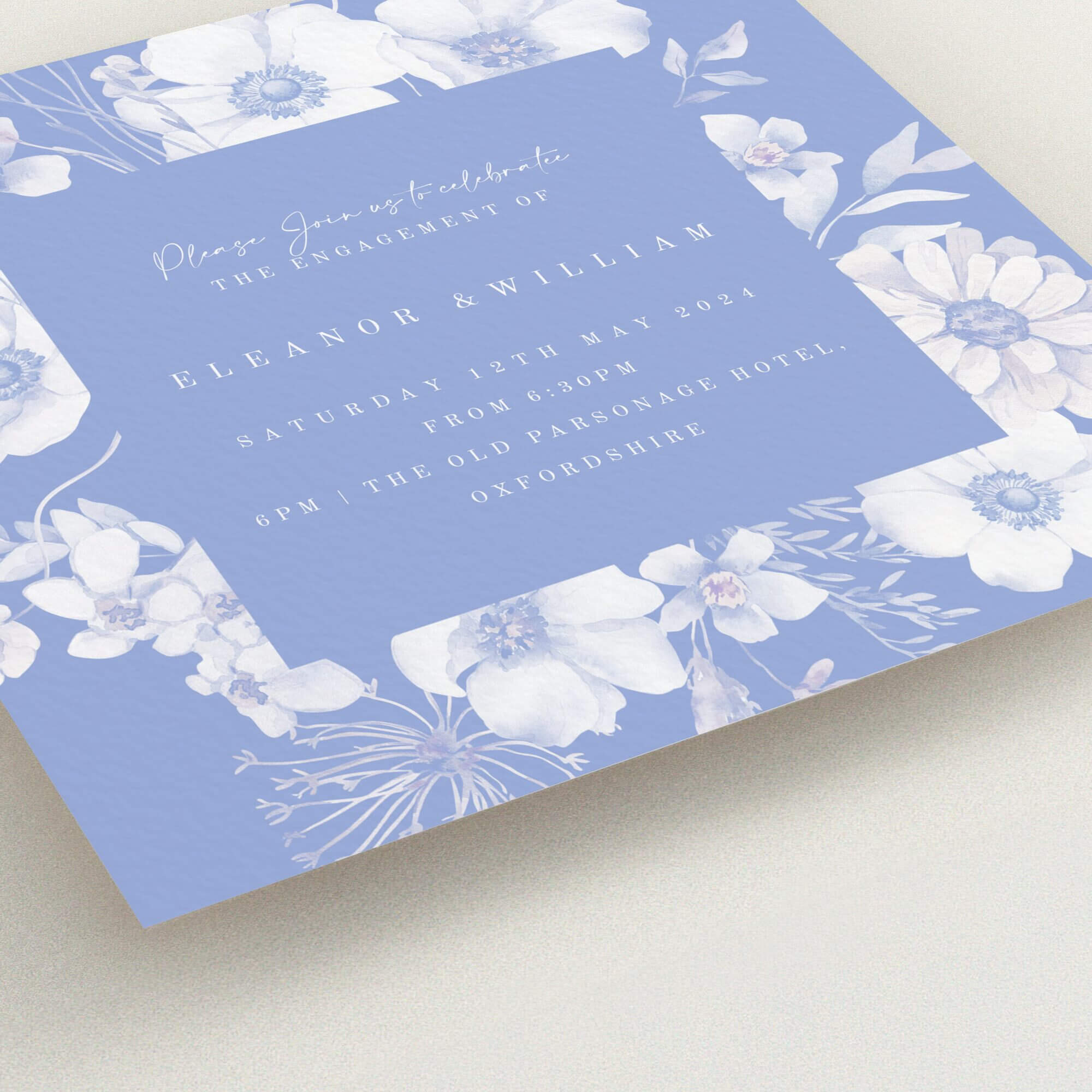 Floral engagement party invitations with blue and white design, including one photo.
