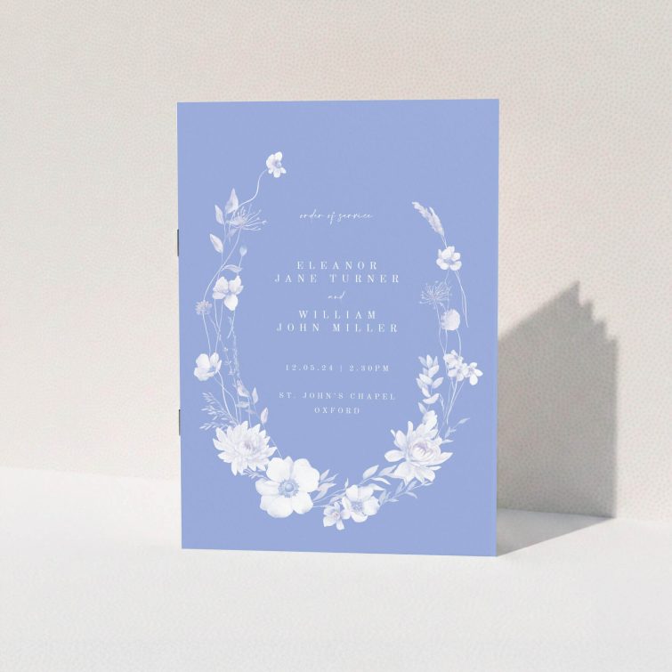 Elegant floral wedding order of service programme with two photos on a lavender background.