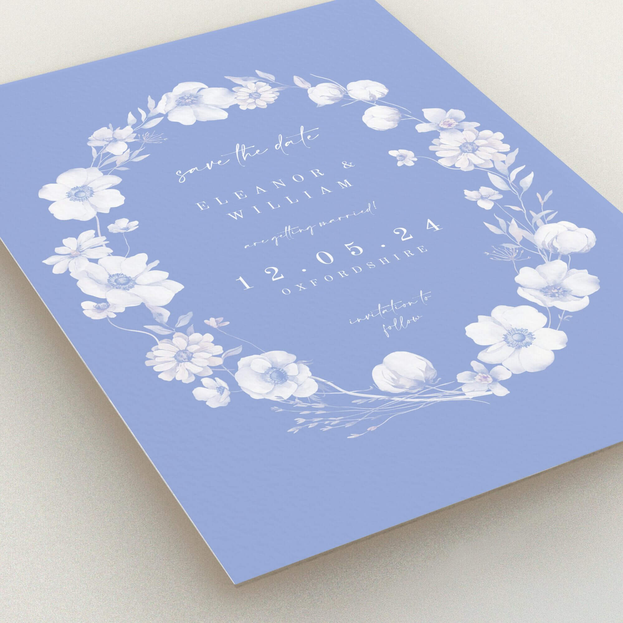 Floral wedding save the date card design with blue background, featuring elegant typography and no photos.
