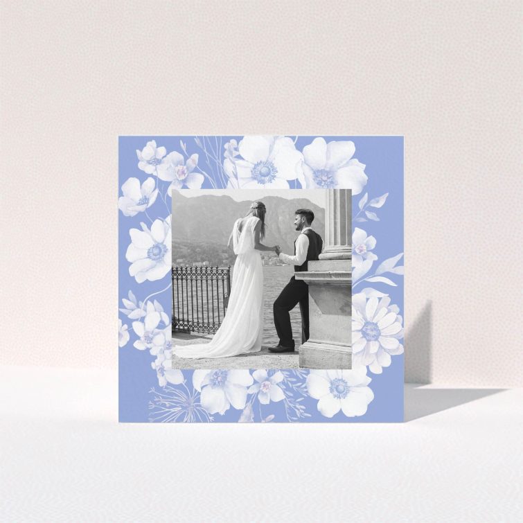 Floral wedding thank you card design with a black and white photo of a couple.