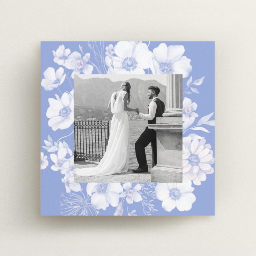 Floral wedding thank you card design with a black and white photo of a couple.