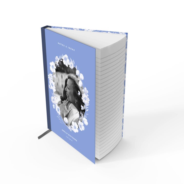 Blue floral notebook cover design with one black and white photo inset on the front.