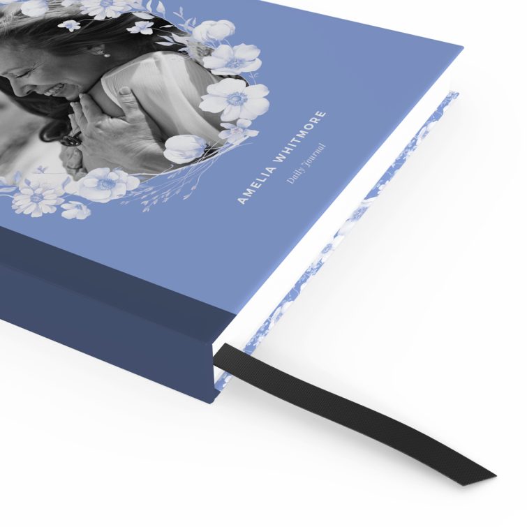 Blue floral notebook cover design with one black and white photo inset on the front.