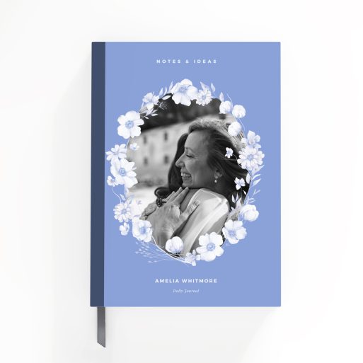 Blue floral notebook cover design with one black and white photo inset on the front.