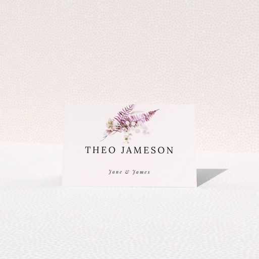 Floral wedding table place card design with elegant typography and botanical illustration.