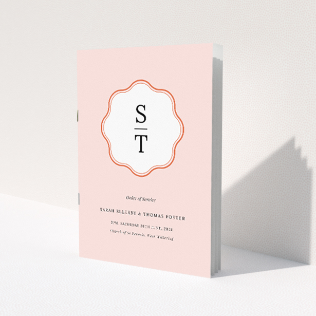Blush Crest Monogram A5 Wedding Order of Service booklet - Personalised elegance with soft blush pink background and classic monogram crest, perfect for contemporary yet personal wedding presentations This is a view of the front