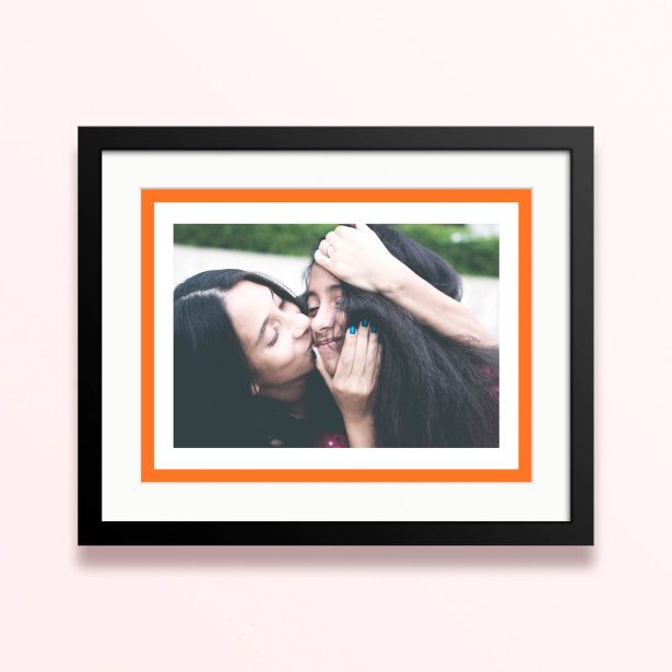 Framed and mounted photo print with one photo featuring an orange border