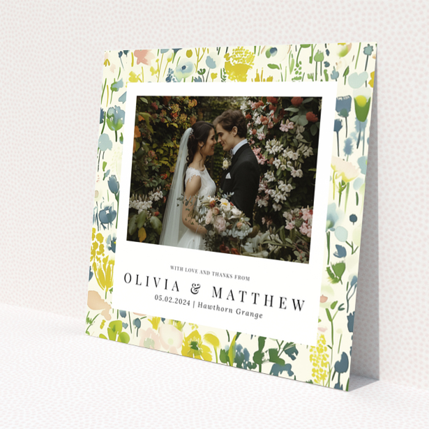 Wedding thank you card with floral design featuring personalised text and one wedding photo