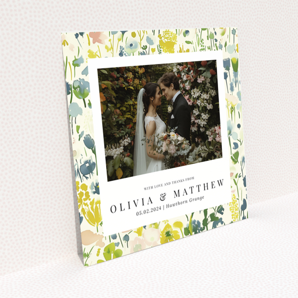 Wedding thank you card with floral design featuring personalised text and one wedding photo