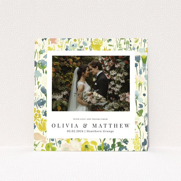 Wedding thank you card with floral design featuring personalised text and one wedding photo