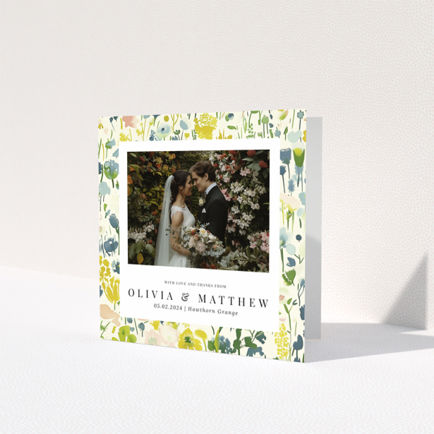 Wedding thank you card with floral design featuring personalised text and one wedding photo