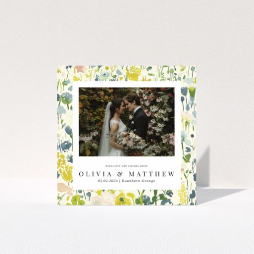 Wedding thank you card with floral design featuring personalised text and one wedding photo