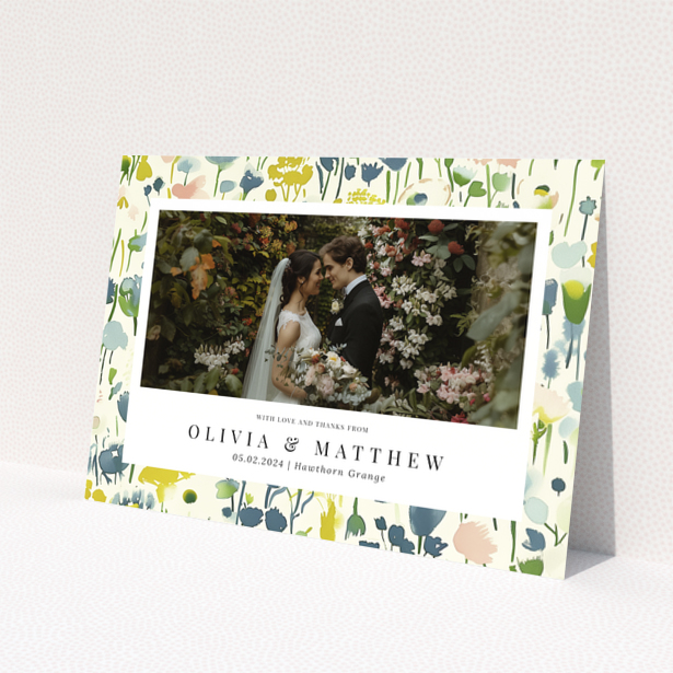 Wedding thank you card with floral design featuring personalised text and one wedding photo