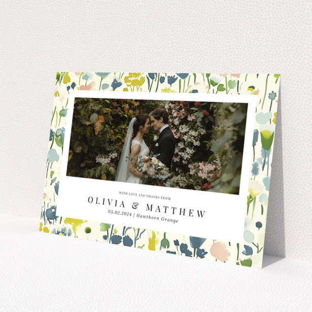 Wedding thank you card with floral design featuring personalised text and one wedding photo