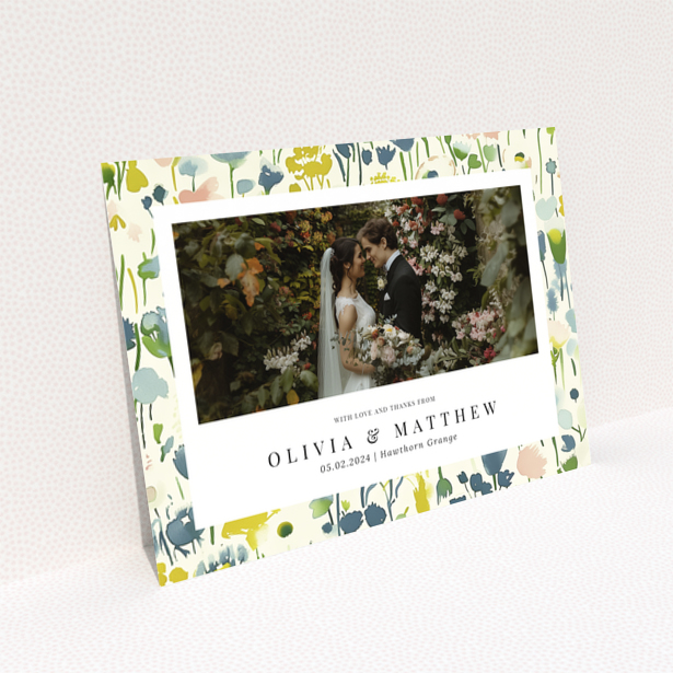 Wedding thank you card with floral design featuring personalised text and one wedding photo