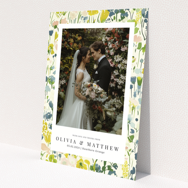 Wedding thank you card with floral design featuring personalised text and one wedding photo