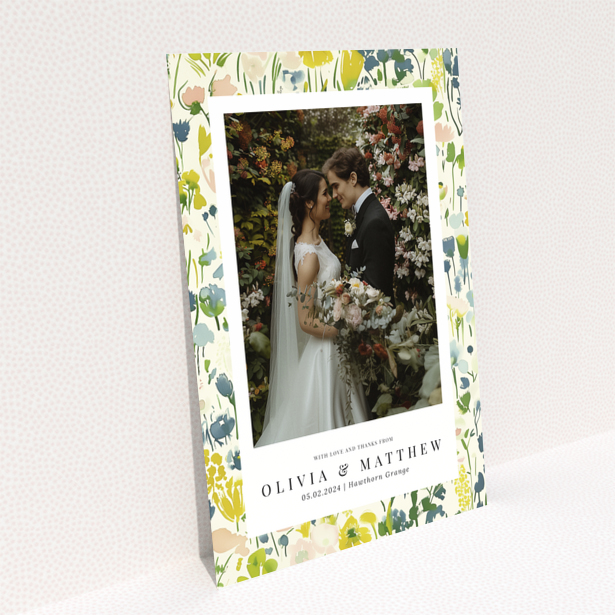 Wedding thank you card with floral design featuring personalised text and one wedding photo
