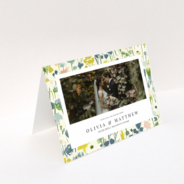 Wedding thank you card with floral design featuring personalised text and one wedding photo