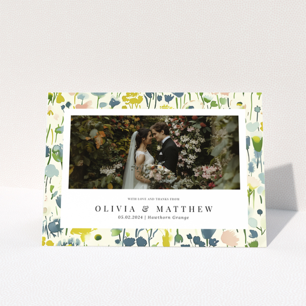 Wedding thank you card with floral design featuring personalised text and one wedding photo