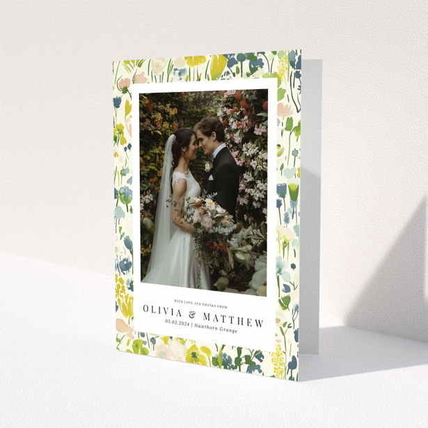 Wedding thank you card with floral design featuring personalised text and one wedding photo