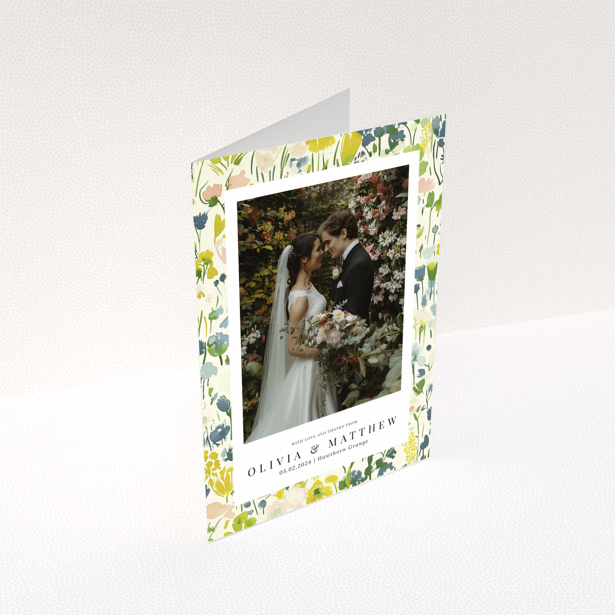 Wedding thank you card with floral design featuring personalised text and one wedding photo