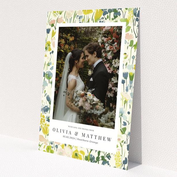 Wedding thank you card with floral design featuring personalised text and one wedding photo