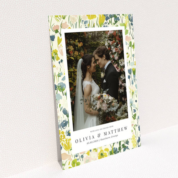 Wedding thank you card with floral design featuring personalised text and one wedding photo