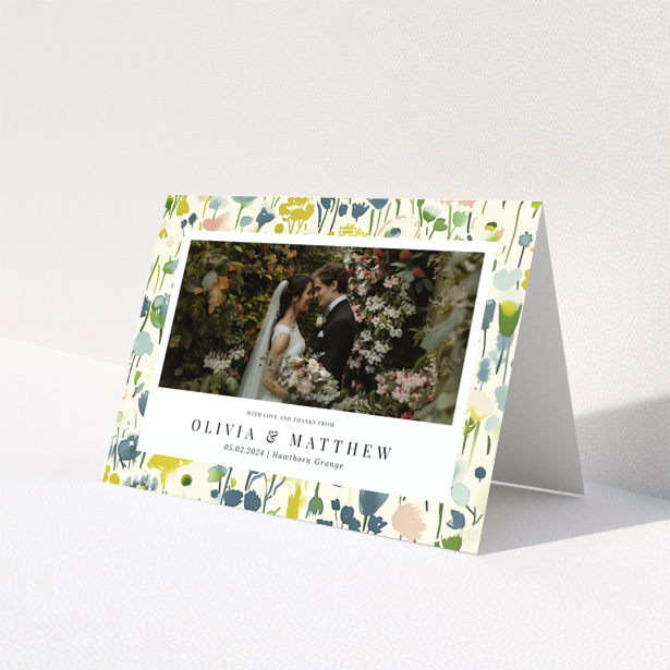 Wedding thank you card with floral design featuring personalised text and one wedding photo