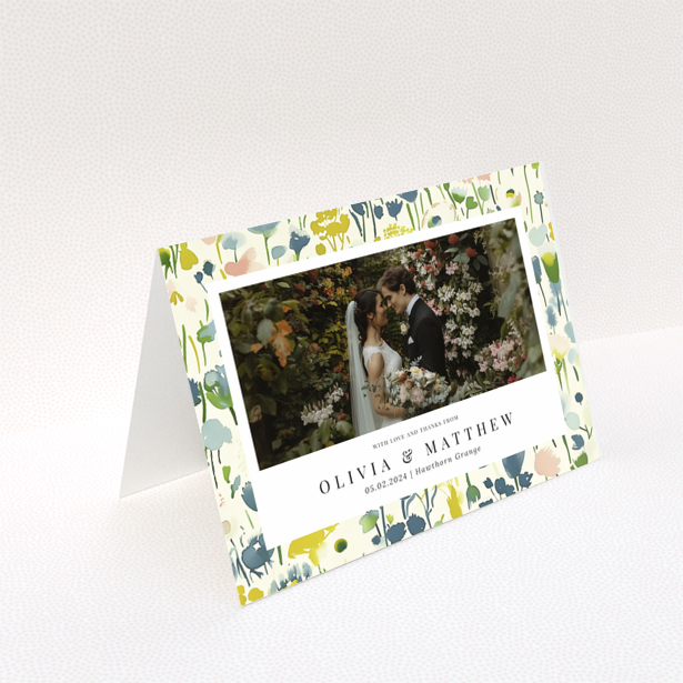 Wedding thank you card with floral design featuring personalised text and one wedding photo