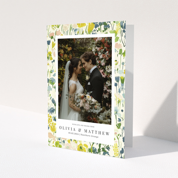 Wedding thank you card with floral design featuring personalised text and one wedding photo