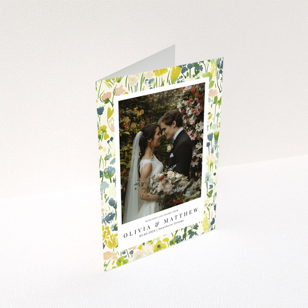 Wedding thank you card with floral design featuring personalised text and one wedding photo