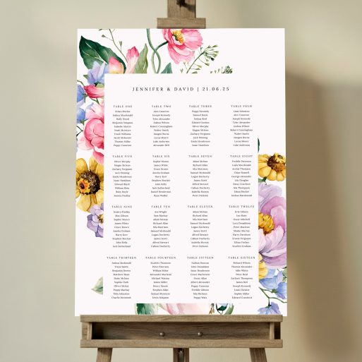 Floral wedding table plan with sixteen tables and two photos, featuring a decorative flower border. This one shows 16 tables.
