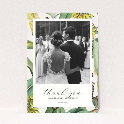 Wedding thank you card with bride and groom, floral border, and one photo.