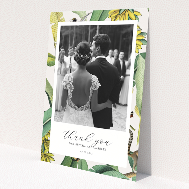 Wedding thank you card with bride and groom, floral border, and one photo.