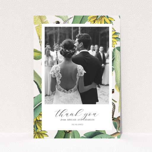 Wedding thank you card with bride and groom, floral border, and one photo.