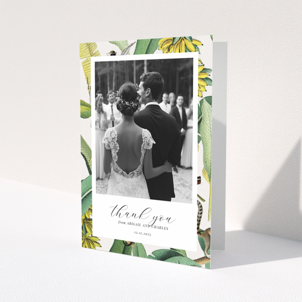 Wedding thank you card with bride and groom, floral border, and one photo.
