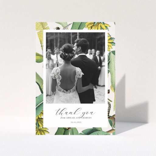 Wedding thank you card with bride and groom, floral border, and one photo.