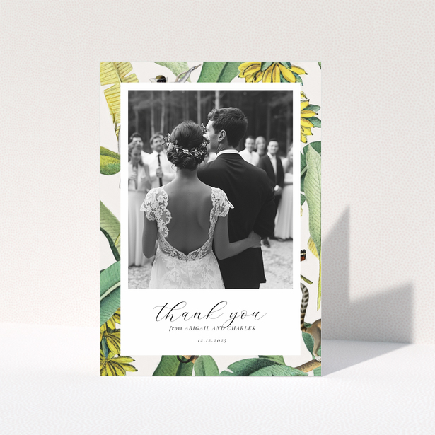 Wedding thank you card with bride and groom, floral border, and one photo.