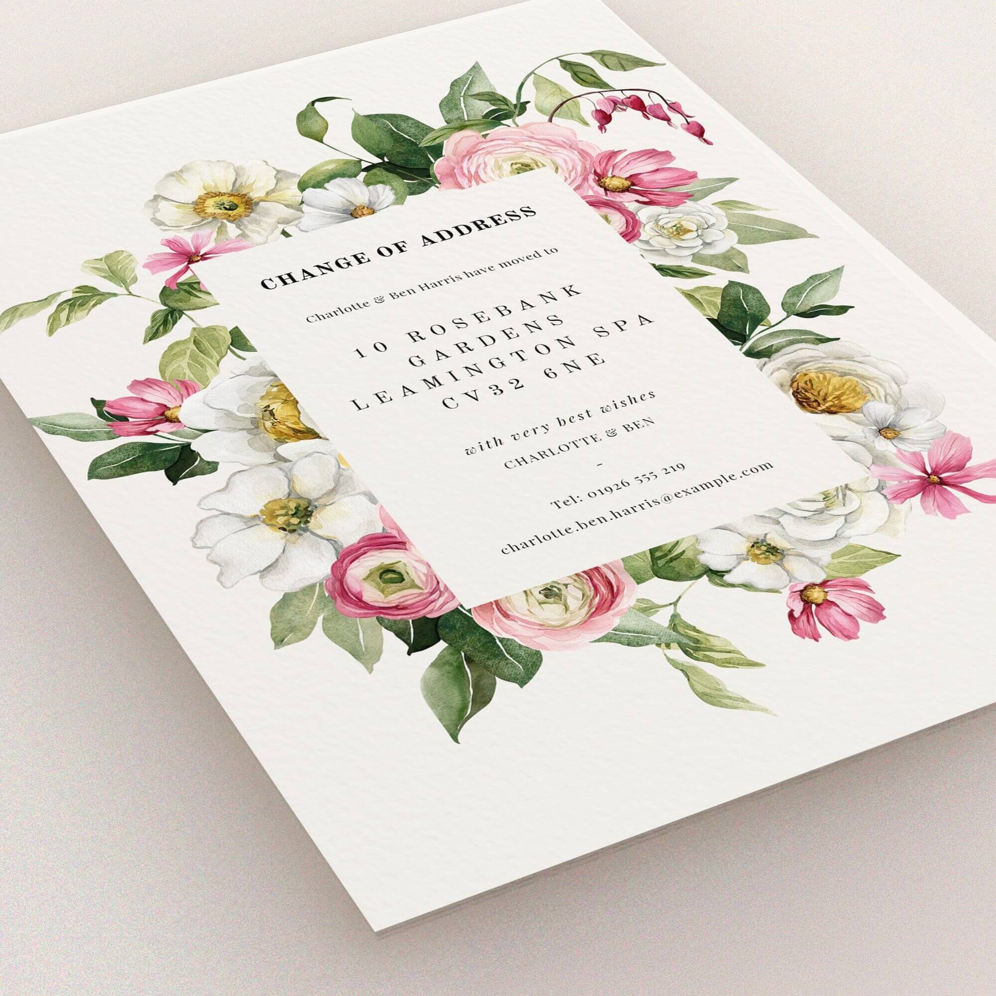 Floral change of address card with elegant design and decorative elements.
