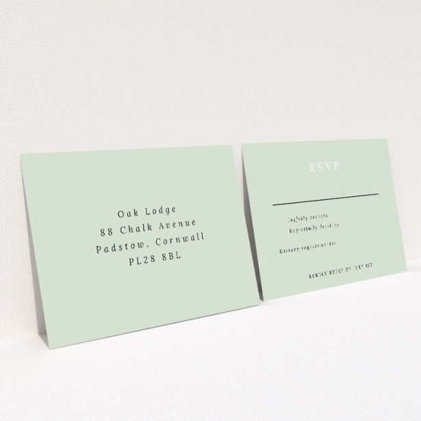 RSVP card template from the 'Botanical Welcome' suite, showcasing minimalist design with botanical elements on a serene sage background, exuding elegance and timeless beauty with a touch of nature This is a view of the back