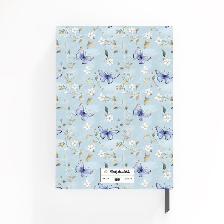 Floral butterfly design daily notebook cover with light blue background and one decorative photo.