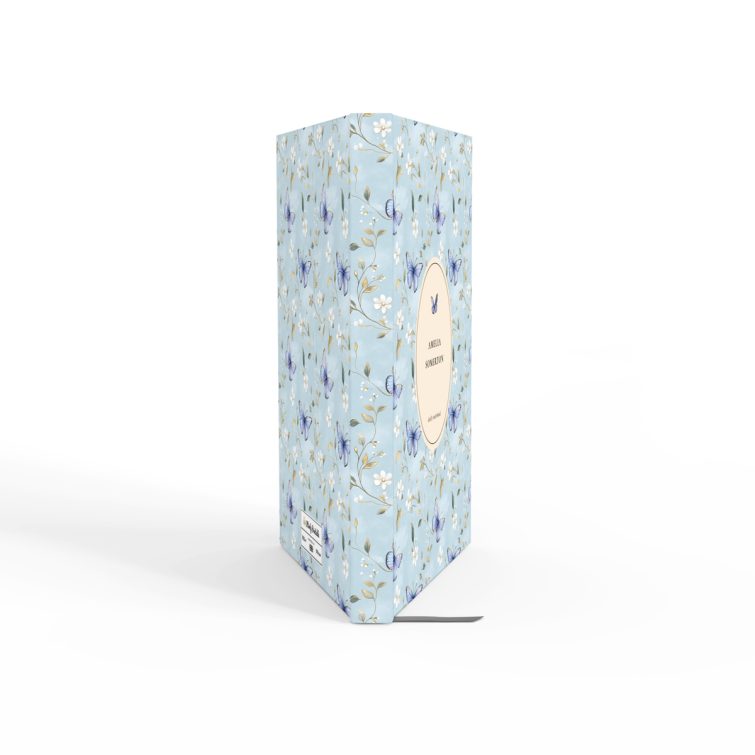 Floral butterfly design daily notebook cover with light blue background and one decorative photo.